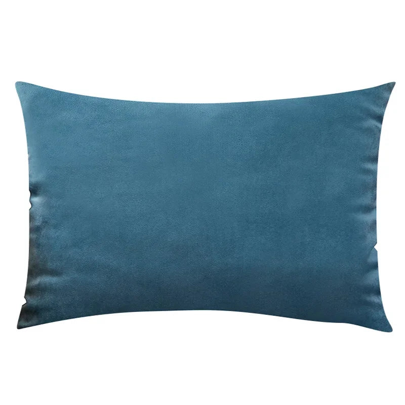 A solid teal velvet throw pillow cover with a smooth texture.