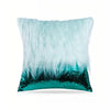 A cushion cover featuring a fluffy light blue feather trim over a dark teal sequin base.