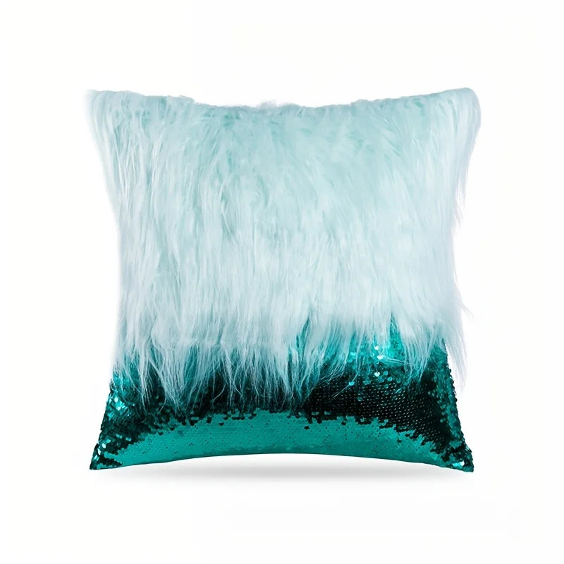 A cushion cover featuring a fluffy light blue feather trim over a dark teal sequin base.
