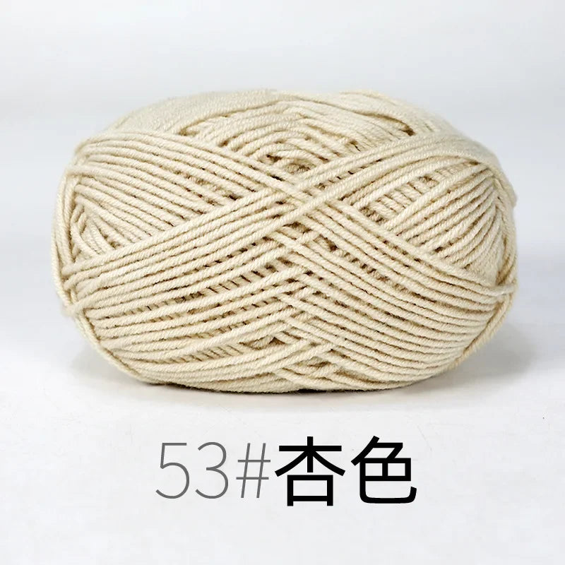 A ball of cream-colored organic cotton 4ply knitting yarn for crafts.