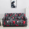 A modern gray and black patterned sofa covered with a geometric floral design.