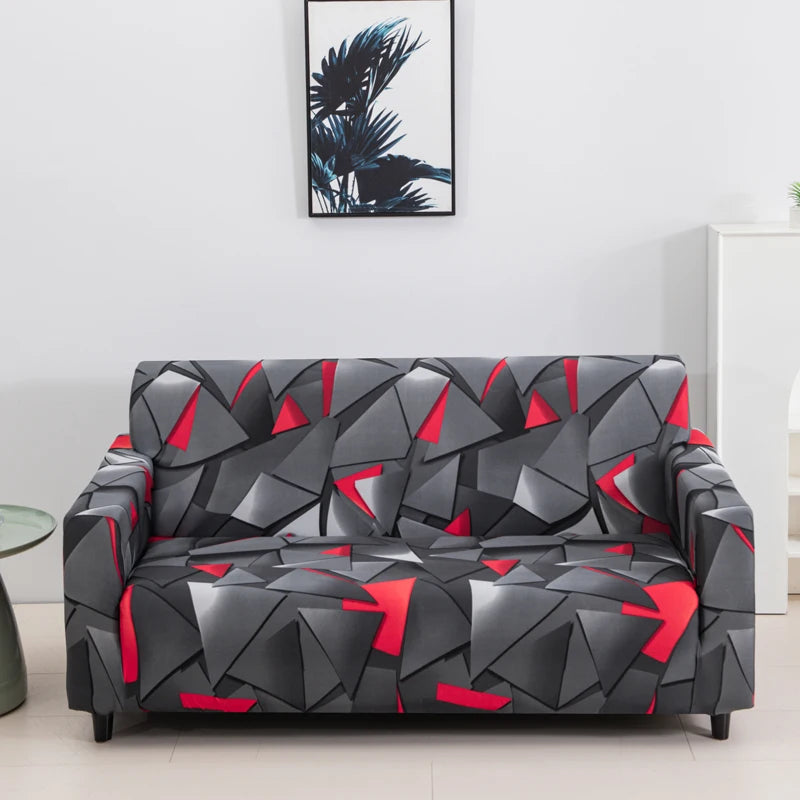 A modern gray and black patterned sofa covered with a geometric floral design.
