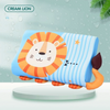 A blue and orange lion-themed memory foam neck pillow for toddlers resting on a white surface.