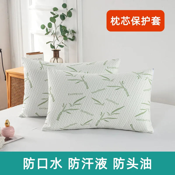 White bamboo pillow protectors displayed on a white surface with text indicating protection from water, detergent, and oil.