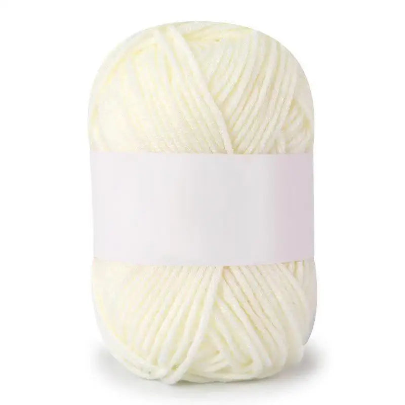 A ball of soft white milk cotton knitting yarn