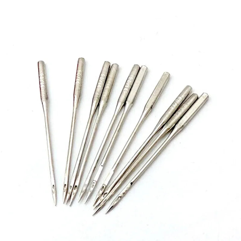 A set of silver precision sewing threading needles arranged diagonally on a white background.