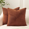 A textured brown corduroy throw pillow cover is shown resting on a white surface.