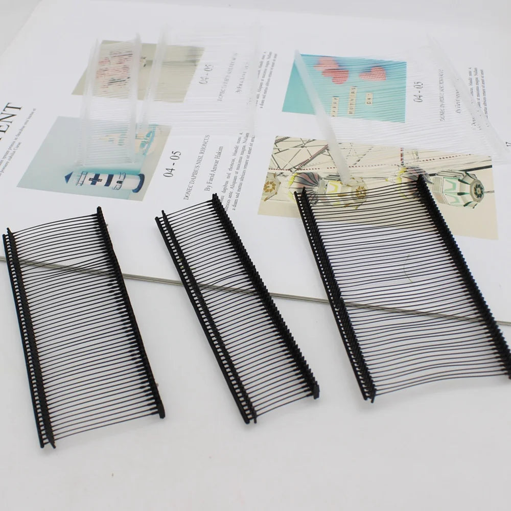 Three precision plastic tagging barbs for labels are displayed on a white background.