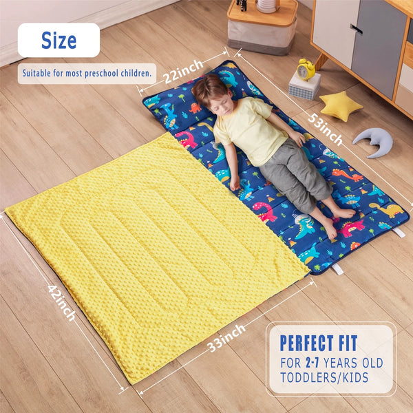 A yellow toddler nap mat with a blue patterned fleece blanket and a removable pillow shown being used by a child.