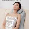 A woman is lying down and using a silver ergonomic memory foam wedge pillow for neck support.