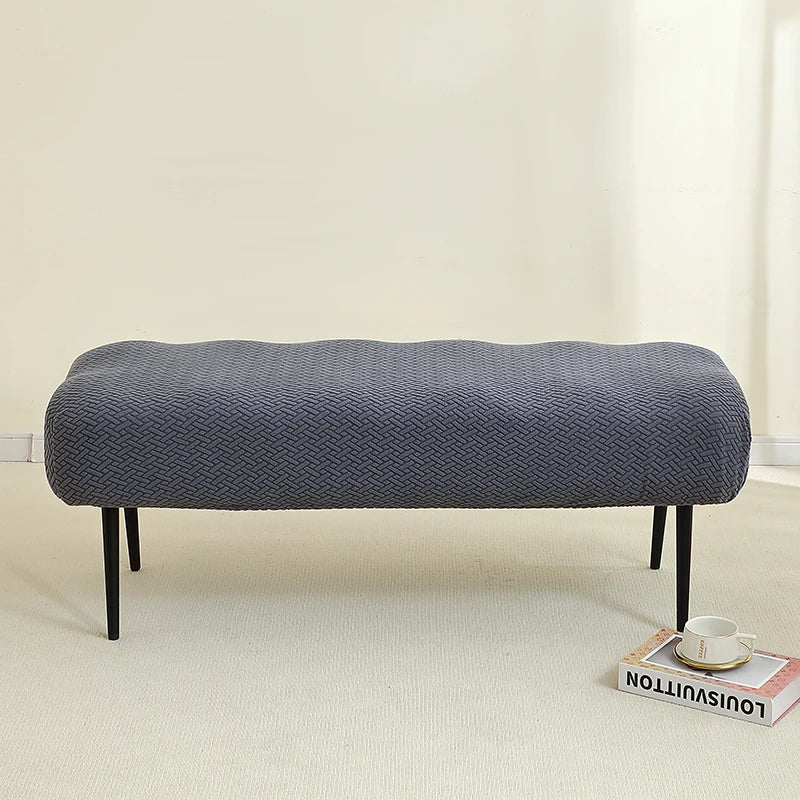 A gray elastic jacquard bench cover designed for piano, dining, or entryway seats.