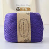Purple bamboo fiber yarn skein labeled as 22 count for crafting
