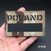 A rectangular tactical patch featuring a camouflage pattern with the word POLAND printed on it.
