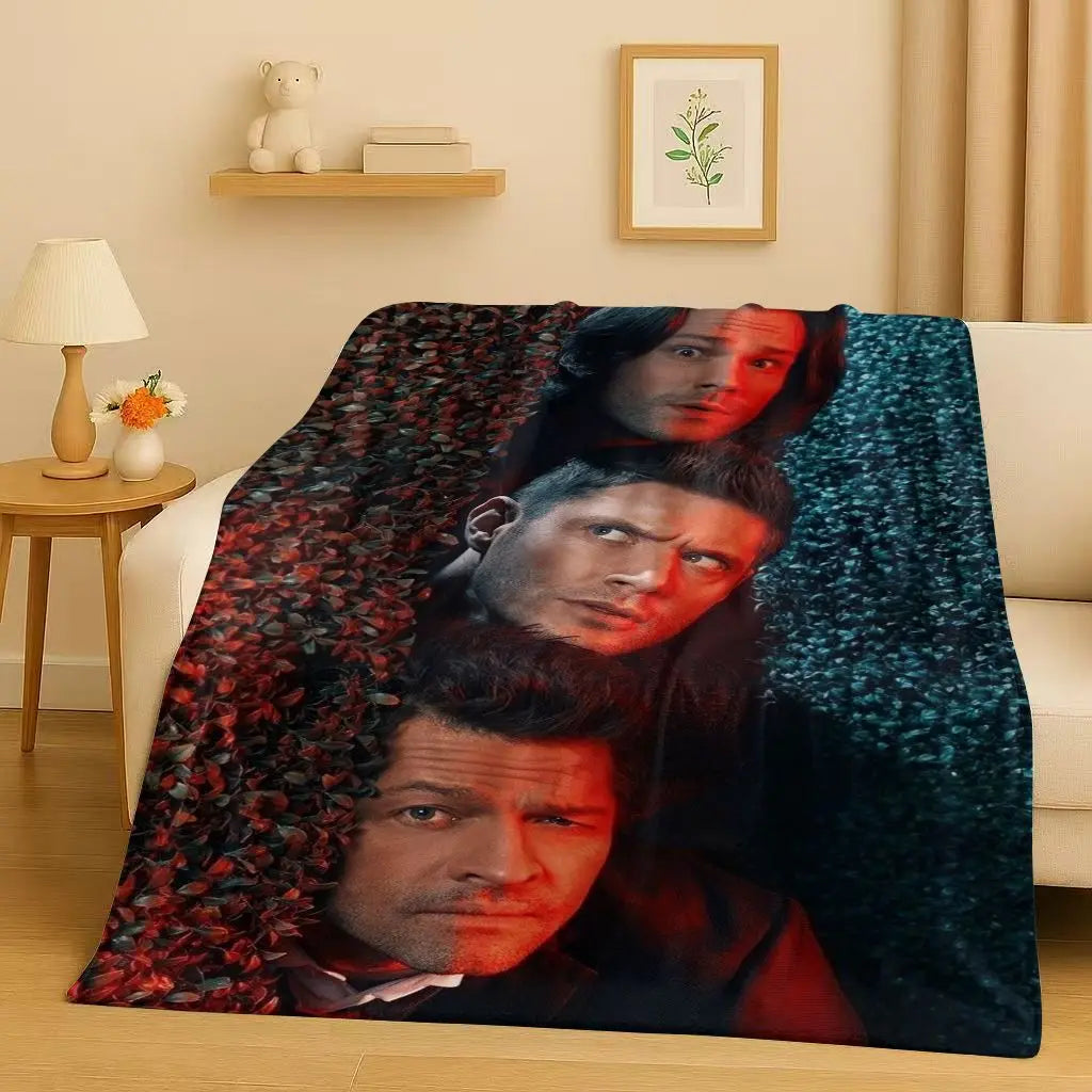 A dark green flannel throw blanket featuring a collage of intense male faces.