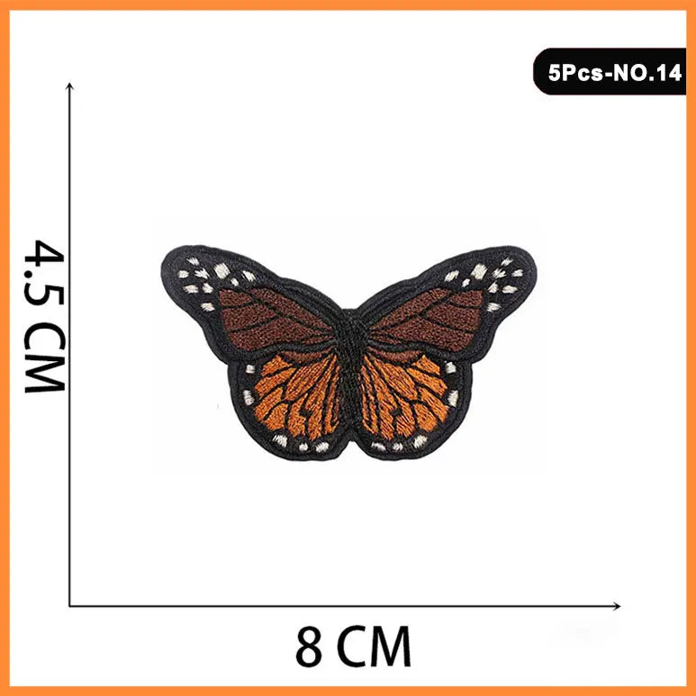 A set of five embroidered butterfly and rose iron-on patches, featuring orange and black detailing.