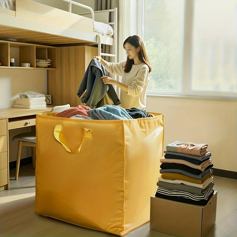 A yellow heavy-duty waterproof storage bag is shown filled with clothing, next to a wooden shelf and window.