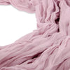 Soft dusty pink rustic gauze table runner fabric draped and folded