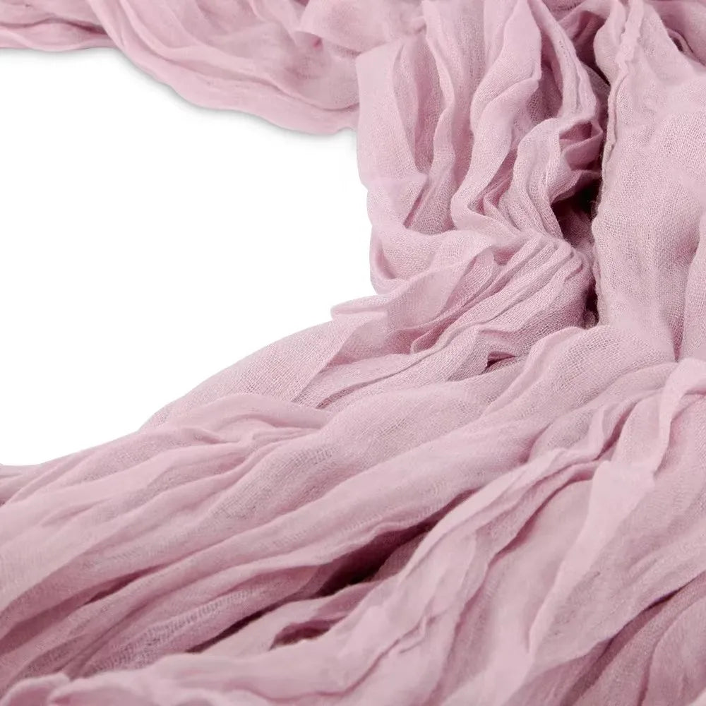 Soft dusty pink rustic gauze table runner fabric draped and folded
