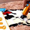A hand is operating a 400W cordless carpet trimmer on a brown rug, demonstrating its use for fabric and detail work.