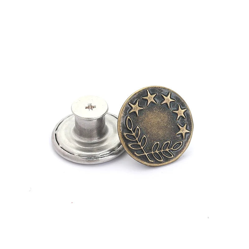 A round, antique brass metal button with a wreath design and five stars.