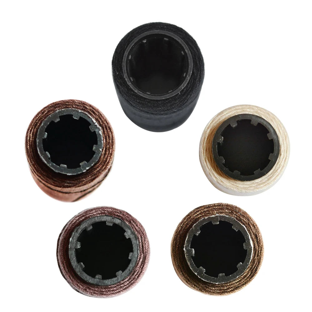 Five rolls of multi-color sewing threads used for hair extensions, shown in various shades.
