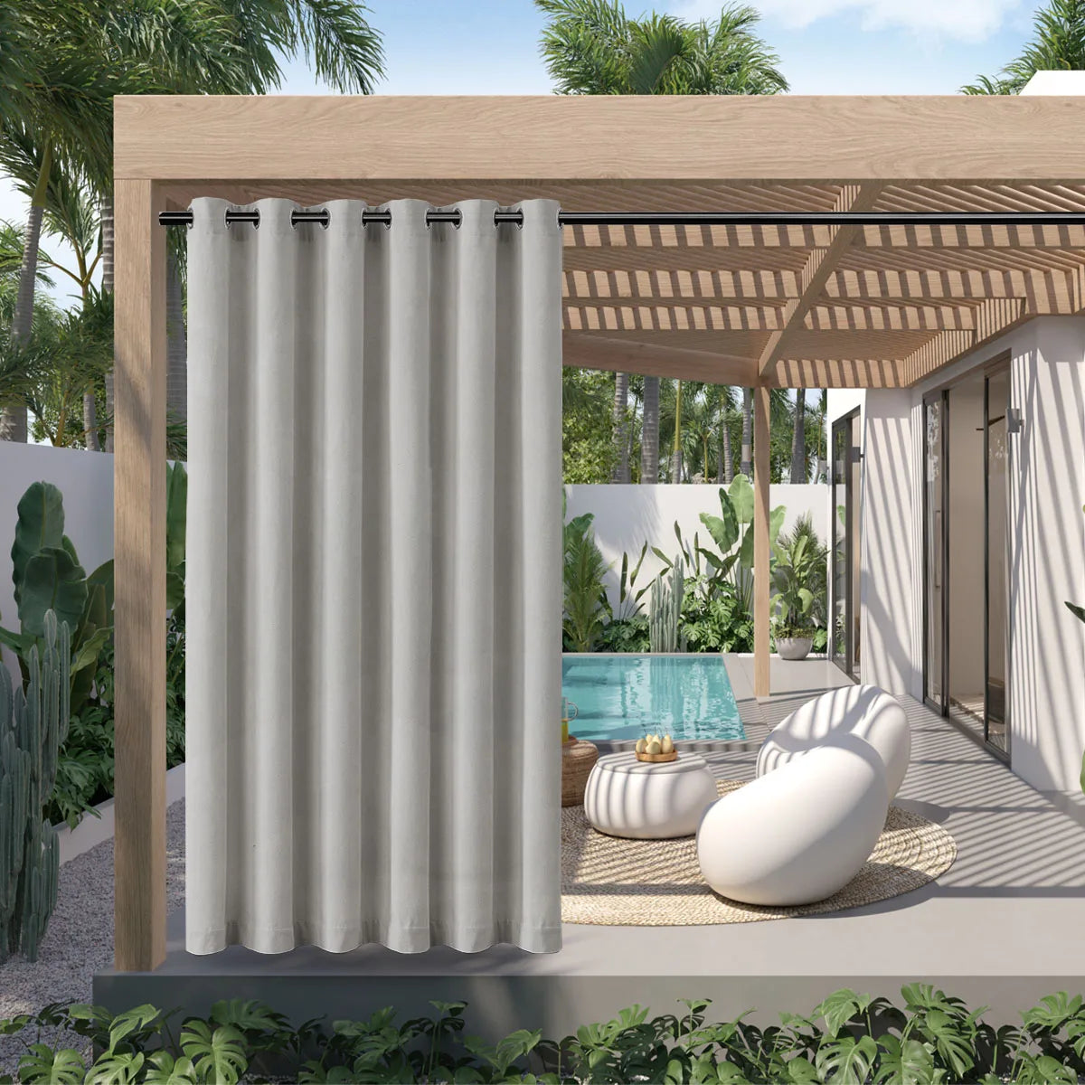A light gray waterproof outdoor curtain with a grommet top hanging in a wooden pergola structure.