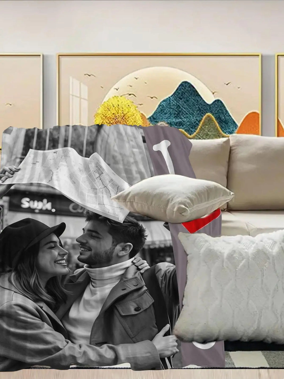 A couple smiling while looking at a map on a flannel blanket in a bright room.