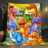 A vibrant blanket featuring various cartoon dinosaurs in bright colors against a yellow background.
