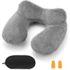 A gray inflatable travel pillow with a soft velvet cover and an orange accessory.