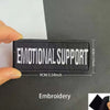 Black embroidered patch with white text Emotional Support measuring 4cm high and 9cm wide