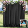 Elegant black curtain panel decorated with floral greenery and pink flowers for party backdrops