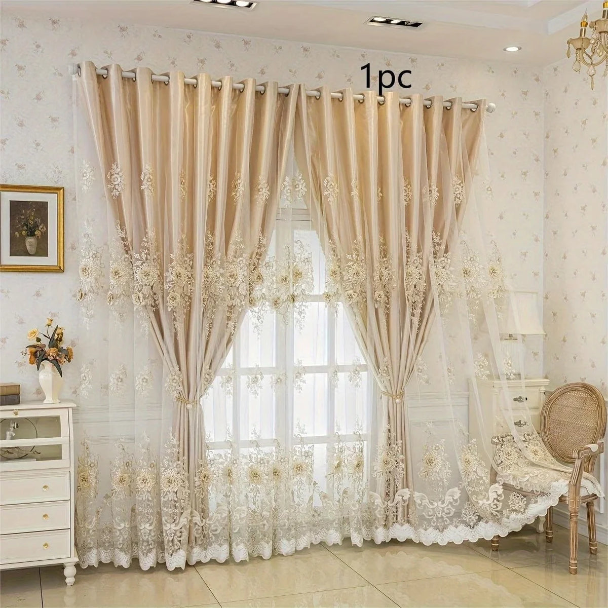 Elegant cream sheer curtains with floral lace detailing hanging in a window.