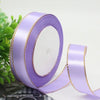 Roll of light purple satin ribbon with a gold edge for gift wrapping and crafts