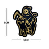 Black silhouette sticker featuring a skull holding a cat with a dagger.
