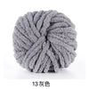 A ball of gray hand-woven chunky chenille yarn