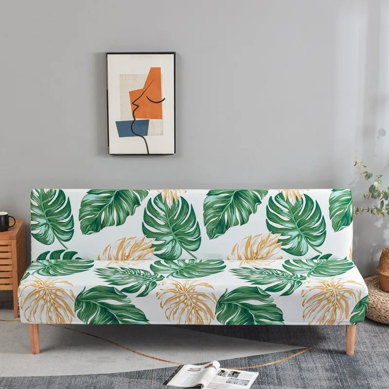 Geometric print spandex slipcovers for sofa beds featuring green and orange leaf patterns on a sofa.