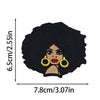 Black crocheted patch featuring a cartoon woman with curly hair and gold earrings
