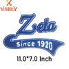 A blue embroidered patch featuring the word Zeta and the text Since 1920.