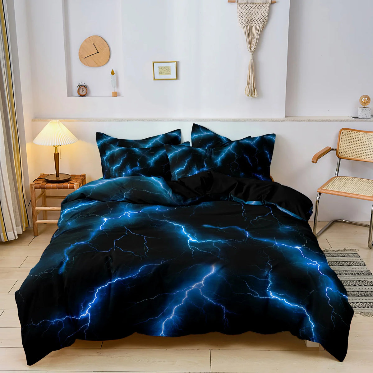 A dark blue and black lightning thunder print duvet cover set displayed on a bed in a bright room.
