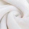 A white, fluffy blanket with a spiral fold, themed for Lord of the Rings.