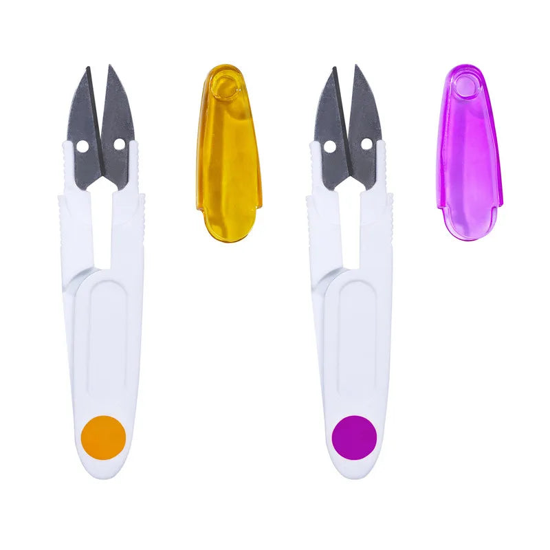 A set of colorful seam ripper and thread cutter tools in yellow, white, and purple.