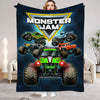 A dark blue blanket featuring a Monster Jam logo and several monster trucks against a dark background.