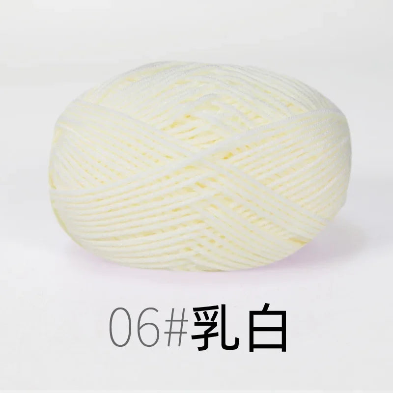 A ball of white organic cotton 4ply knitting yarn for crafts.