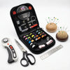 A black sewing kit box containing various tools including scissors needles and a hand tool