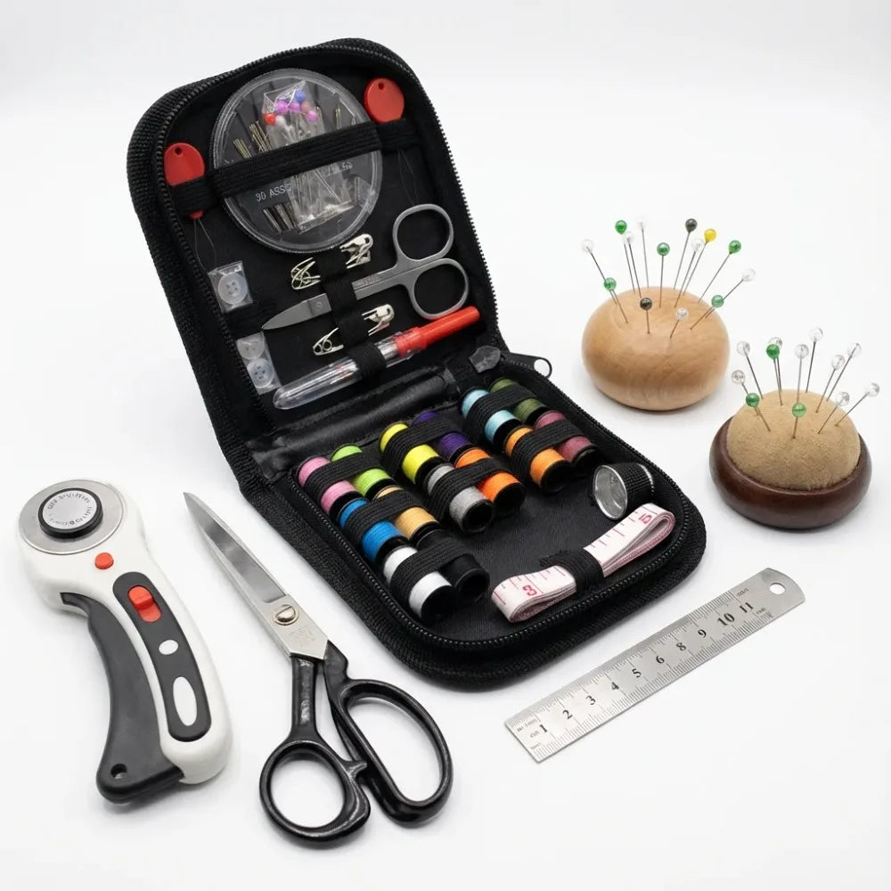 A black sewing kit box containing various tools including scissors needles and a hand tool