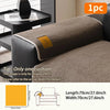 A brown fleece sofa mat is shown on a black sofa, with dimensions of 70cm x 27.6inch.