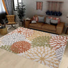 A rectangular outdoor area rug featuring a geometric pattern of various shades including terracotta, olive green, beige, and 