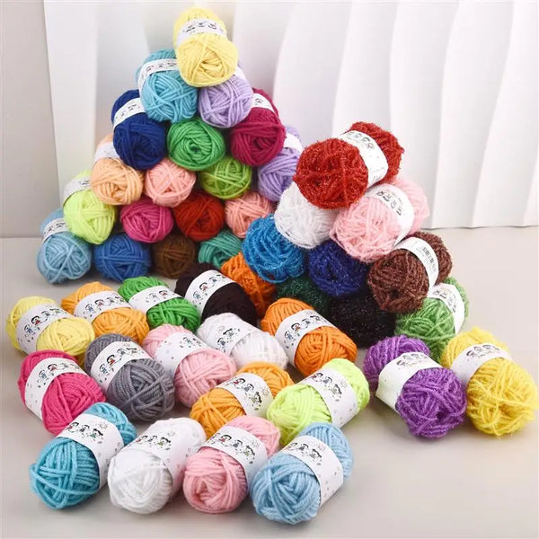 A pyramid display of 12 colors of soft acrylic yarn for knitting projects.