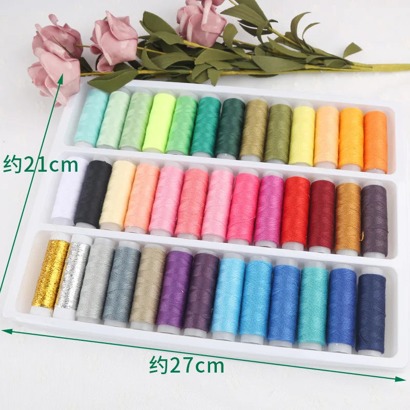 A white box containing 39 colors of sewing thread for embroidery, cross stitch, and knitting, with a sprig of pink roses near