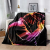 A black flannel blanket featuring a vibrant, abstract design with pink and orange hues.